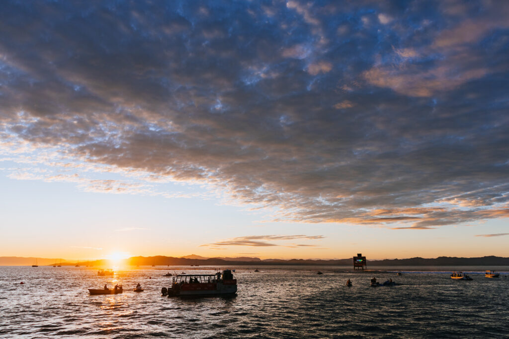 Boat heading out at sunrise in Fiji